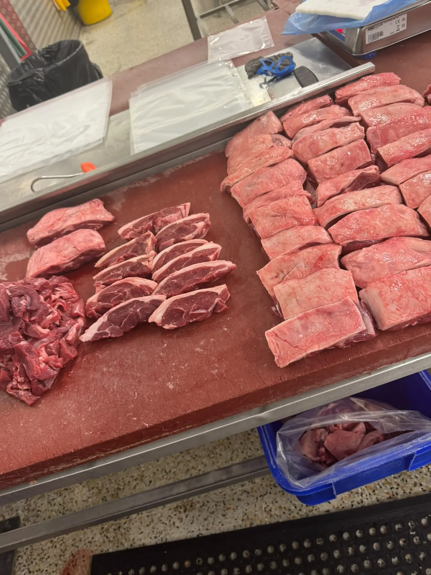 Steaks, chops and diced meat cut and portioned by hand on the butcher's block
