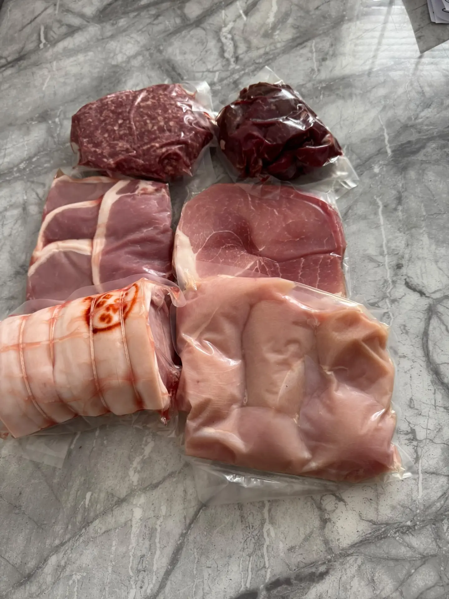 A genuine NEMB order — vacuum-packed mince, diced meat, bacon, gammon and chicken ready for delivery
